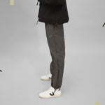 Carica l'immagine nel visualizzatore di Gallery, WATERPROOF ADJUSTABLE TRACK PANTS WORN 1